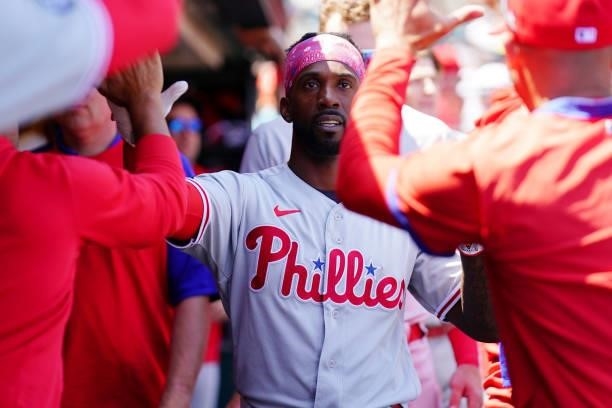Andrew McCutchen of the Philadelphia Phillies celebrates in the dugout during the game between the Philadelphia Phillies and the San Francisco Giants...