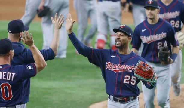 Byron Buxton of the Minnesota Twins celebrates with teammates following their team's 3-2 win over the Texas Rangers at Globe Life Field on June 19,...