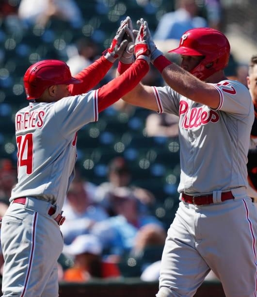 Rhys Hoskins of the Philadelphia Phillies celebrates with Ronald Torreyes after hitting a home run during the game between the Philadelphia Phillies...