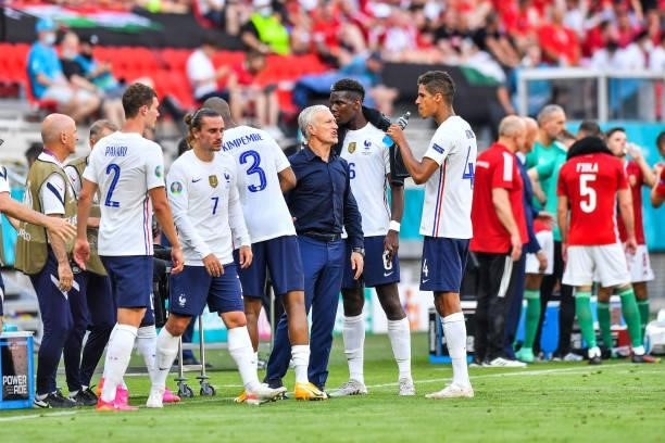Didier DESCHAMPS head coach of France gives instructions to Raphael VARANE of France on a water break during the UEFA European Championship football...