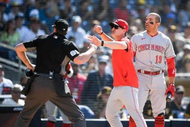 Umpire Ryan Additon throws Cincinnati Reds manager David Bell out of the game as Joey Votto looks on after a call during the first inning of a...