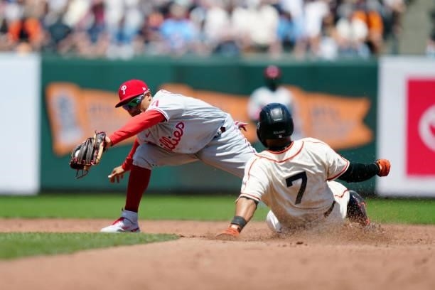 Ronald Torreyes of the Philadelphia Phillies makes a play on Donovan Solano of the San Francisco Giants during the game at Oracle Park on Saturday,...