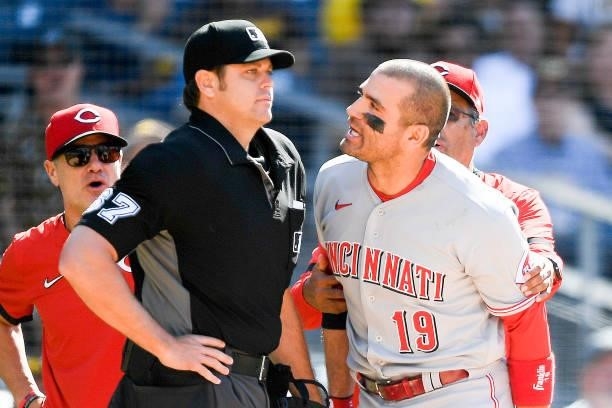 Joey Votto of the Cincinnati Reds yells at umpire Ryan Additon after a call during the first inning of a baseball game against the San Diego Padres...