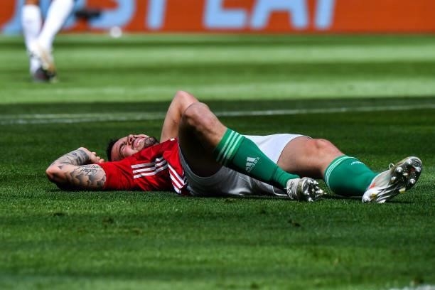 Endre BOTKA of Hungary lies on the pitch injured during the UEFA European Championship football match between Hungary and France at Ferenc Puskas on...