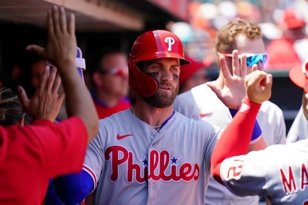 Bryce Harper of the Philadelphia Phillies celebrates in the dugout during the game between the Philadelphia Phillies and the San Francisco Giants at...