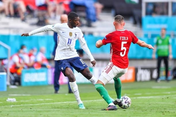 Ousmane DEMBELE of France and Attila FIOLA of Hungary during the UEFA European Championship football match between Hungary and France at Ferenc...