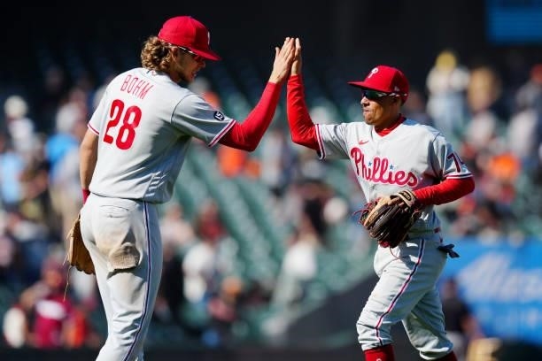 Alec Bohm and Ronald Torreyes of the Philadelphia Phillies celebrate after the Phillies defeated the San Francisco Giants at Oracle Park on Saturday,...