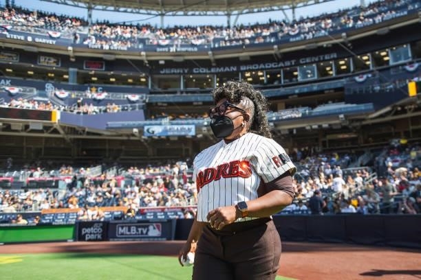 Dr. Alicia Gwynn, wife of Tony Gwynn, takes the field to throw the ceremonial first pitch before the San Diego Padres against the Cincinnati Reds on...