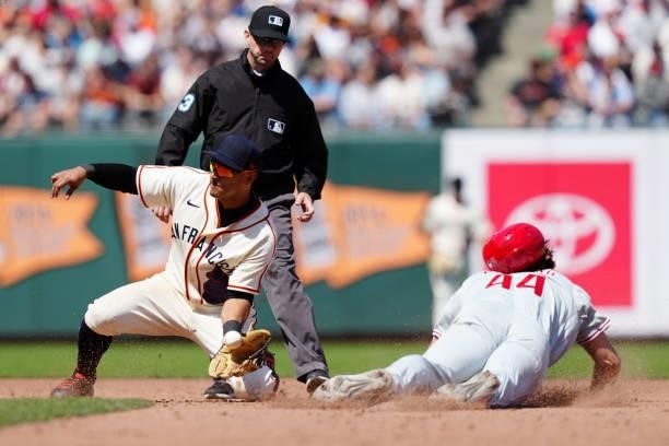 Donovan Solano of the San Francisco Giants attempts to make a play on Matt Vierling of the Philadelphia Phillies during the game between the...