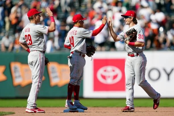 Nick Mason, Ronald Torreyes and Luke Williams of the Philadelphia Phillies celebrate after the Phillies defeated the San Francisco Giants at Oracle...