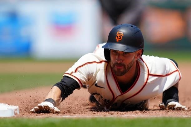 Steven Duggar of the San Francisco Giants dives back to first on a pick off attempt during the game between the Philadelphia Phillies and the San...