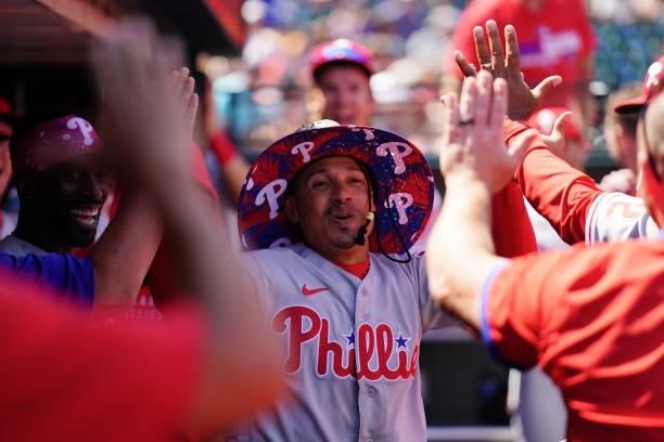 Ronald Torreyes of the Philadelphia Phillies celebrates in the dugout with the home run hat after hitting a home run during the game between the...