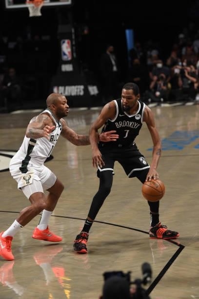 Kevin Durant of the Brooklyn Nets handles the ball against P.J. Tucker of the Milwaukee Bucks during Round 2, Game 7 on June 19, 2021 at Barclays...