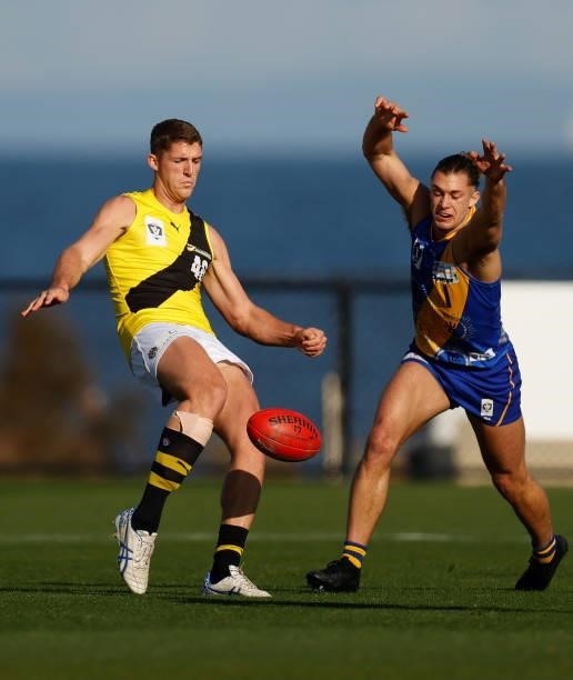 Ben Miller of the Tigers kicks the ball during the VFL Round 10 match between the Williamstown Seagulls and the Richmond Tigers at Downer Oval on...