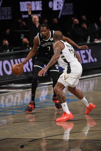 Kevin Durant of the Brooklyn Nets handles the ball against P.J. Tucker of the Milwaukee Bucks during Round 2, Game 7 on June 19, 2021 at Barclays...
