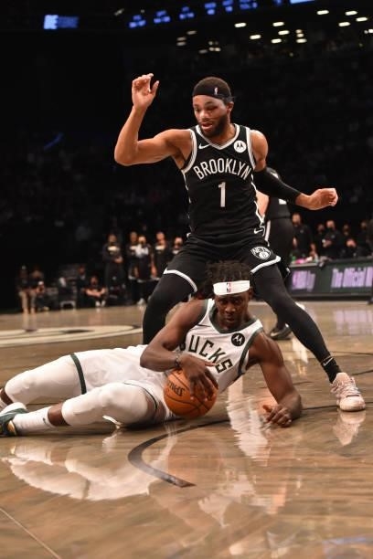 Jrue Holiday of the Milwaukee Bucks and Bruce Brown of the Brooklyn Nets fight for the ball during Round 2, Game 7 on June 19, 2021 at Barclays...
