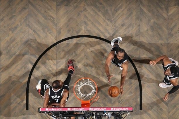 James Harden of the Brooklyn Nets rebounds the ball during the game against the Milwaukee Bucks during Round 2, Game 7 of the 2021 NBA Playoffs on...
