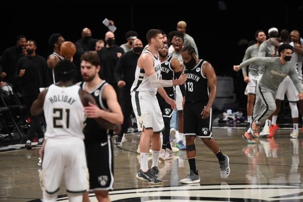 Brook Lopez of the Milwaukee Bucks and James Harden of the Brooklyn Nets high-five during Round 2, Game 7 on June 19, 2021 at Barclays Center in...