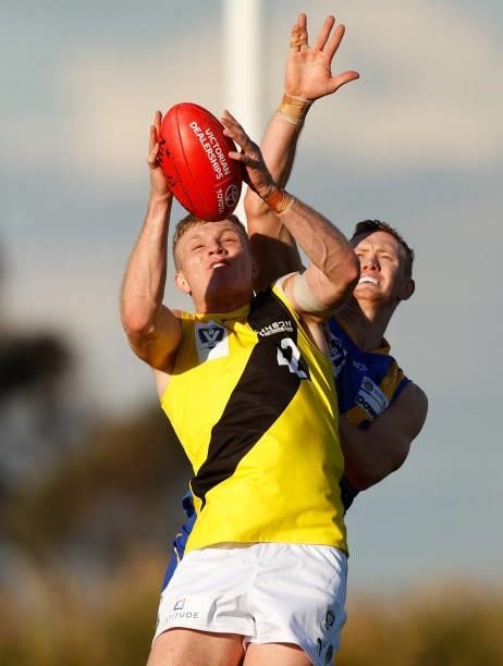 Ryan Garthwaite of the Tigers and Liam Hunt of the Seagulls compete for the ball during the VFL Round 10 match between the Williamstown Seagulls and...