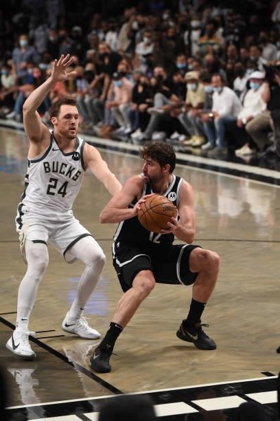 Joe Harris of the Brooklyn Nets handles the ball against Pat Connaughton of the Milwaukee Bucks during Round 2, Game 7 on June 19, 2021 at Barclays...