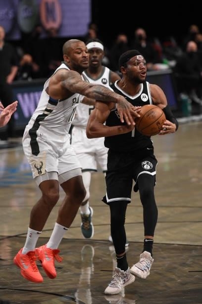 Bruce Brown of the Brooklyn Nets handles the ball against P.J. Tucker of the Milwaukee Bucks during Round 2, Game 7 on June 19, 2021 at Barclays...