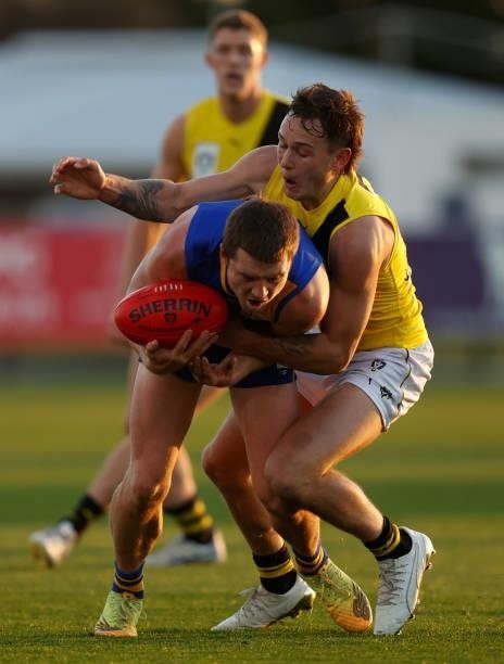 Corey Rich of the Seagulls is tackled by Rhyan Mansell of the Tigers during the VFL Round 10 match between the Williamstown Seagulls and the Richmond...