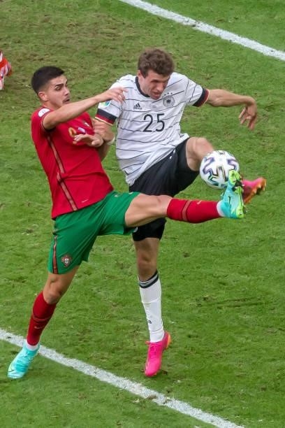 Andre Silva of Portugal and Thomas Mueller of Germany battle for the ball during the UEFA Euro 2020 Championship Group F match between Portugal and...