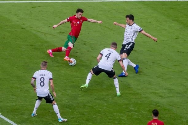 Toni Kroos of Germany, Diogo Jota of Portugal, Mats Hummels of Germany and Matthias Ginter of Germany battle for the ball during the UEFA Euro 2020...