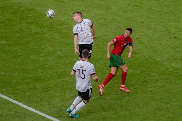 Matthias Ginter of Germany and Niklas Suele of Germany and Cristiano Ronaldo of Portugal battle for the ball during the UEFA Euro 2020 Championship...