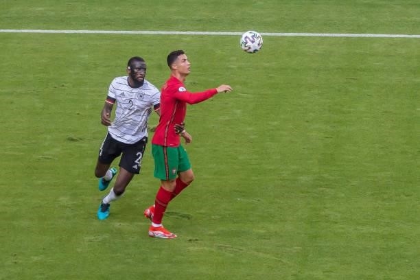 Antonio Ruediger of Germany and Cristiano Ronaldo of Portugal battle for the ball during the UEFA Euro 2020 Championship Group F match between...