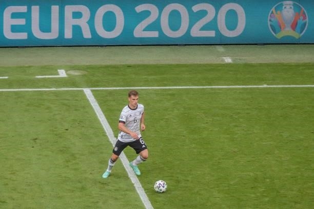 Joshua Kimmich of Germany controls the ball during the UEFA Euro 2020 Championship Group F match between Portugal and Germany at Football Arena...