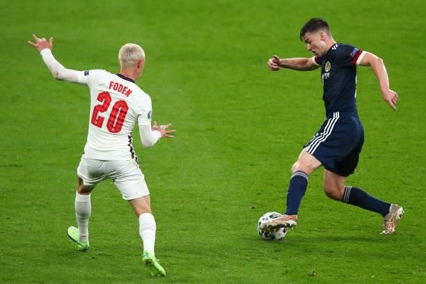 Phil Foden of England and Kieran Tierney of Scotland during the UEFA Euro 2020 Championship Group D match between England and Scotland at Wembley...