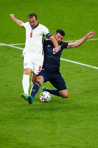 Harry Kane of England and Grant Hanley of Scotland during the UEFA Euro 2020 Championship Group D match between England and Scotland at Wembley...