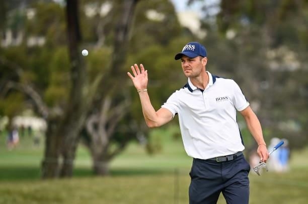 Martin Kaymer of Germany catches his ball on the first hole green during the second round of the 121st U.S. Open on the South Course at Torrey Pines...