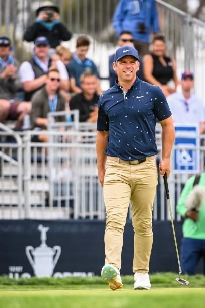Paul Casey of England smiles after making a birdie putt on the 15th hole green during the third round of the 121st U.S. Open on the South Course at...