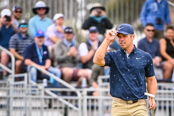 Paul Casey of England tips his cap to fans after making a birdie putt on the 15th hole green during the third round of the 121st U.S. Open on the...