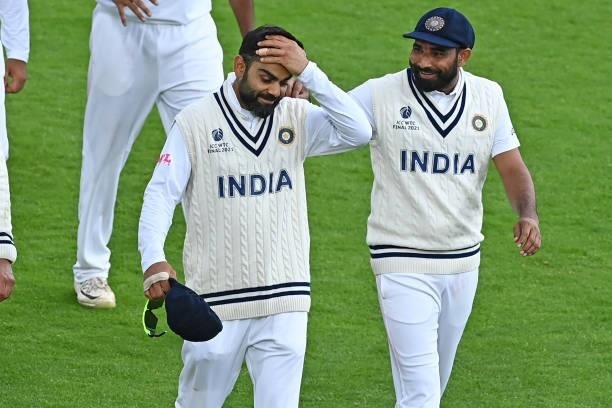 India's Virat Kohli reacts as they leave the field after bad light stops play on the third day of the ICC World Test Championship Final between New...