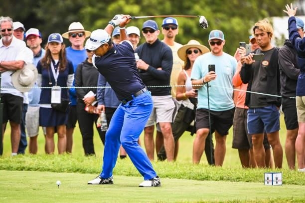 Hideki Matsuyama of Japan at the top of his swing as he plays his shot from the 14th tee as fans watch during the third round of the 121st U.S. Open...