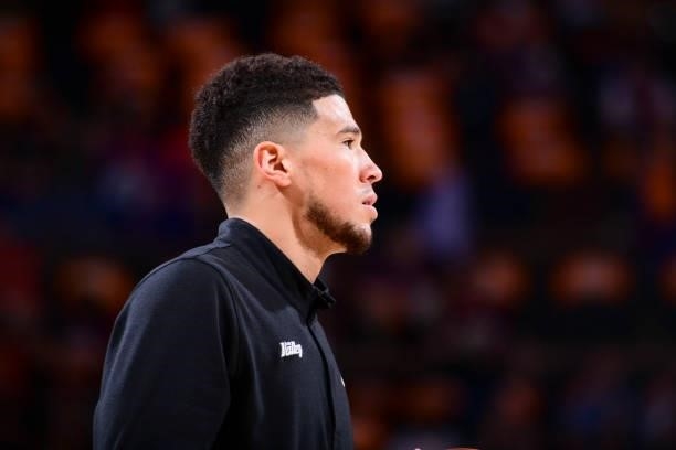 Devin Booker of the Phoenix Suns looks on before the game against the LA Clippers during Game 1 of the Western Conference Finals of the 2021 NBA...