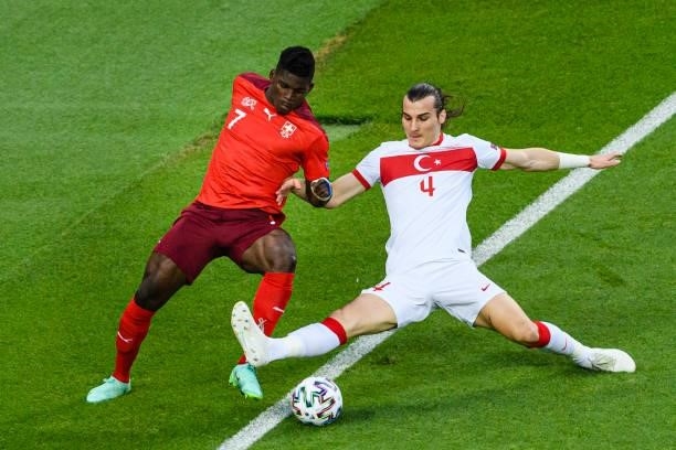 Caglar Soyuncu of Turkey battles for the ball with Breel Embolo of Switzerland during the UEFA Euro 2020 Championship Group A match between...