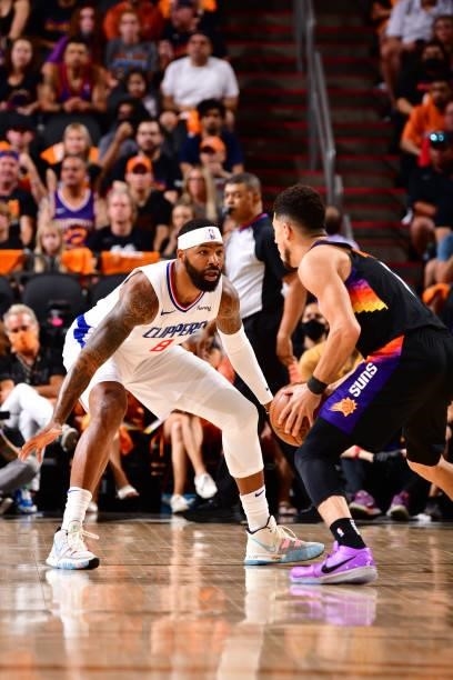 Marcus Morris Sr. #8 of the LA Clippers plays defense on Devin Booker of the Phoenix Suns during Game 1 of the Western Conference Finals of the 2021...