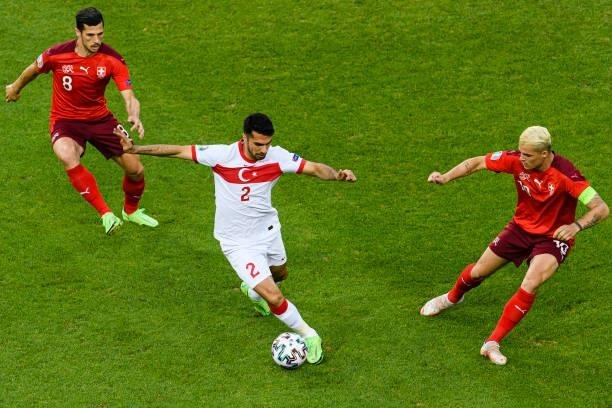 Mehmet Zeki Celik of Turkey plays against Granit Xhaka of Switzerland during the UEFA Euro 2020 Championship Group A match between Switzerland and...