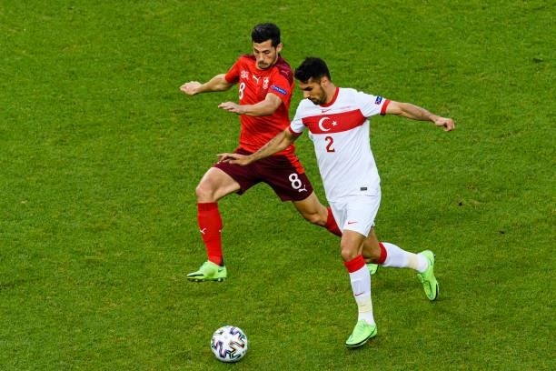 Mehmet Zeki Celik of Turkey plays against Remo Freuler of Switzerland during the UEFA Euro 2020 Championship Group A match between Switzerland and...