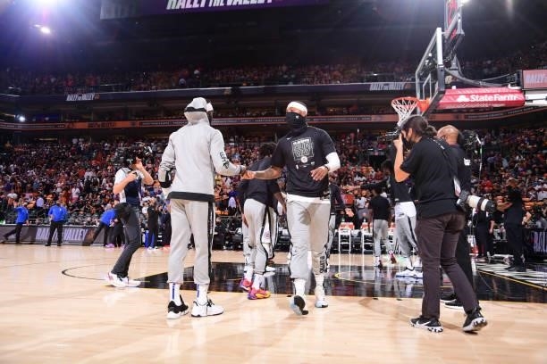 Marcus Morris Sr. #8 of the LA Clippers high fives Reggie Jackson of the LA Clippers before the game against the Phoenix Suns during Game 1 of the...