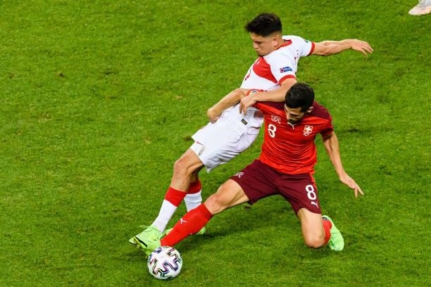 Remo Freuler of Switzerland battles for the ball with Cengiz Under of Turkey during the UEFA Euro 2020 Championship Group A match between Switzerland...