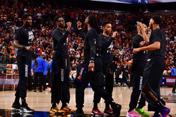 Phoenix Suns players high-five each other before the game against the LA Clippers during Game 1 of the Western Conference Finals of the 2021 NBA...