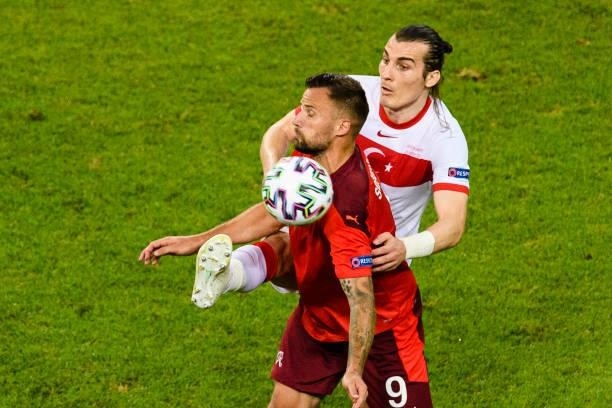 Caglar Soyuncu of Turkey battles for the ball with Haris Seferovic of Switzerland during the UEFA Euro 2020 Championship Group A match between...