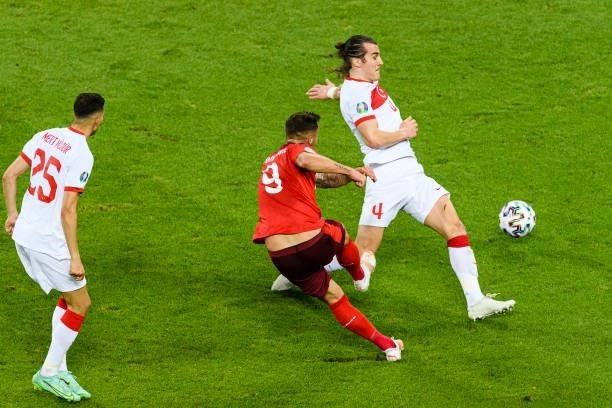 Haris Seferovic of Switzerland attempts a kick while being defended by Caglar Soyuncu of Turkey during the UEFA Euro 2020 Championship Group A match...