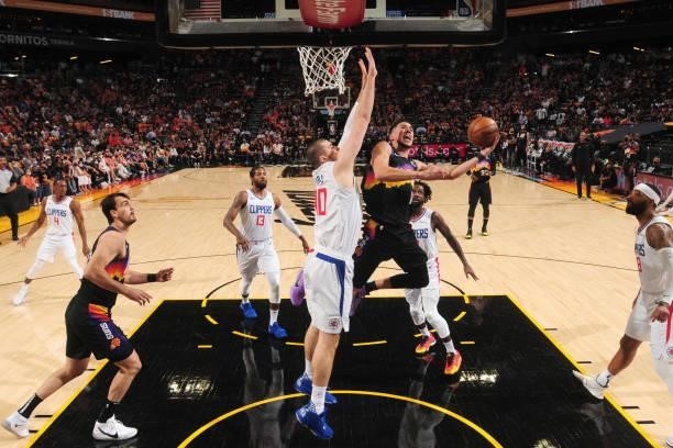 Devin Booker of the Phoenix Suns shoots the ball during the game against the LA Clippers during Game 1 of the Western Conference Finals of the 2021...