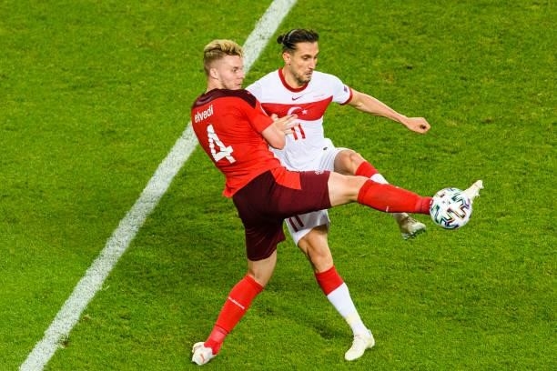 Nico Elvedi of Switzerland battles for the ball with Yusuf Yazici of Turkey during the UEFA Euro 2020 Championship Group A match between Switzerland...